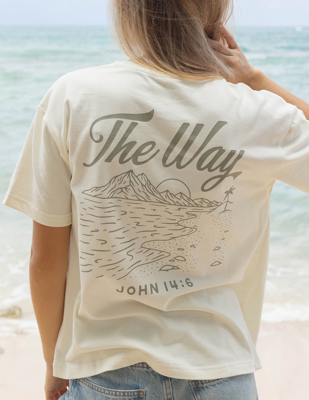 Elevated Faith Christian Apparel T-Shirt featuring a beach design and biblical quote on the back