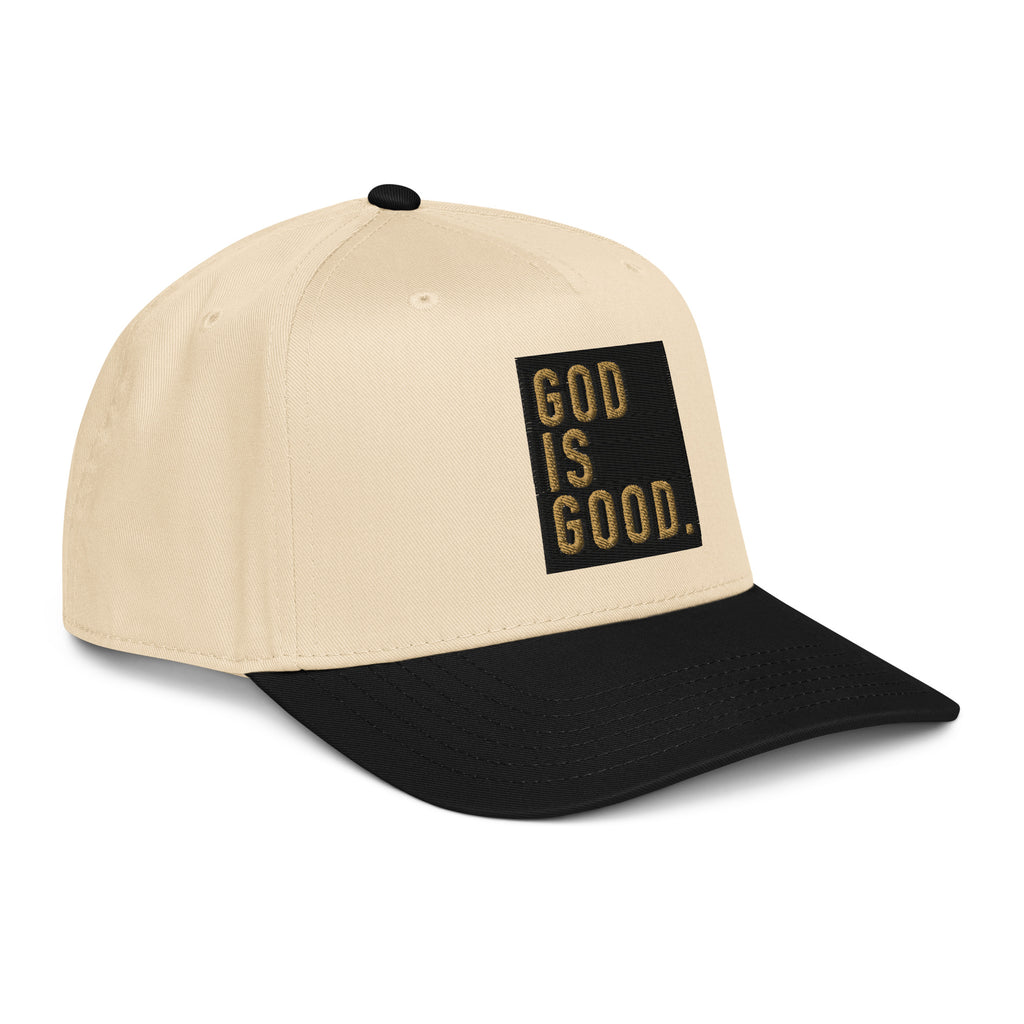 Beige and black snapback cap with 'GOD IS GOOD' text, perfect for fans of Christian jewelry