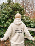 Elevated Faith Christian Hoodie featuring 'Fruit of the Spirit' graphic on the back in a soft beige color