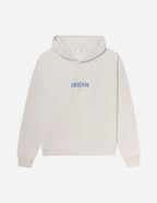 Elevated Faith Christian Hoodie in beige with 'FREEDOM' text design on the front