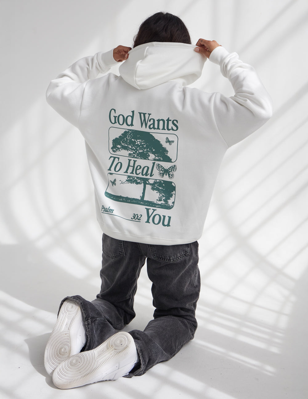 Elevated Faith Christian Hoodie in white with a healing message graphic on the back