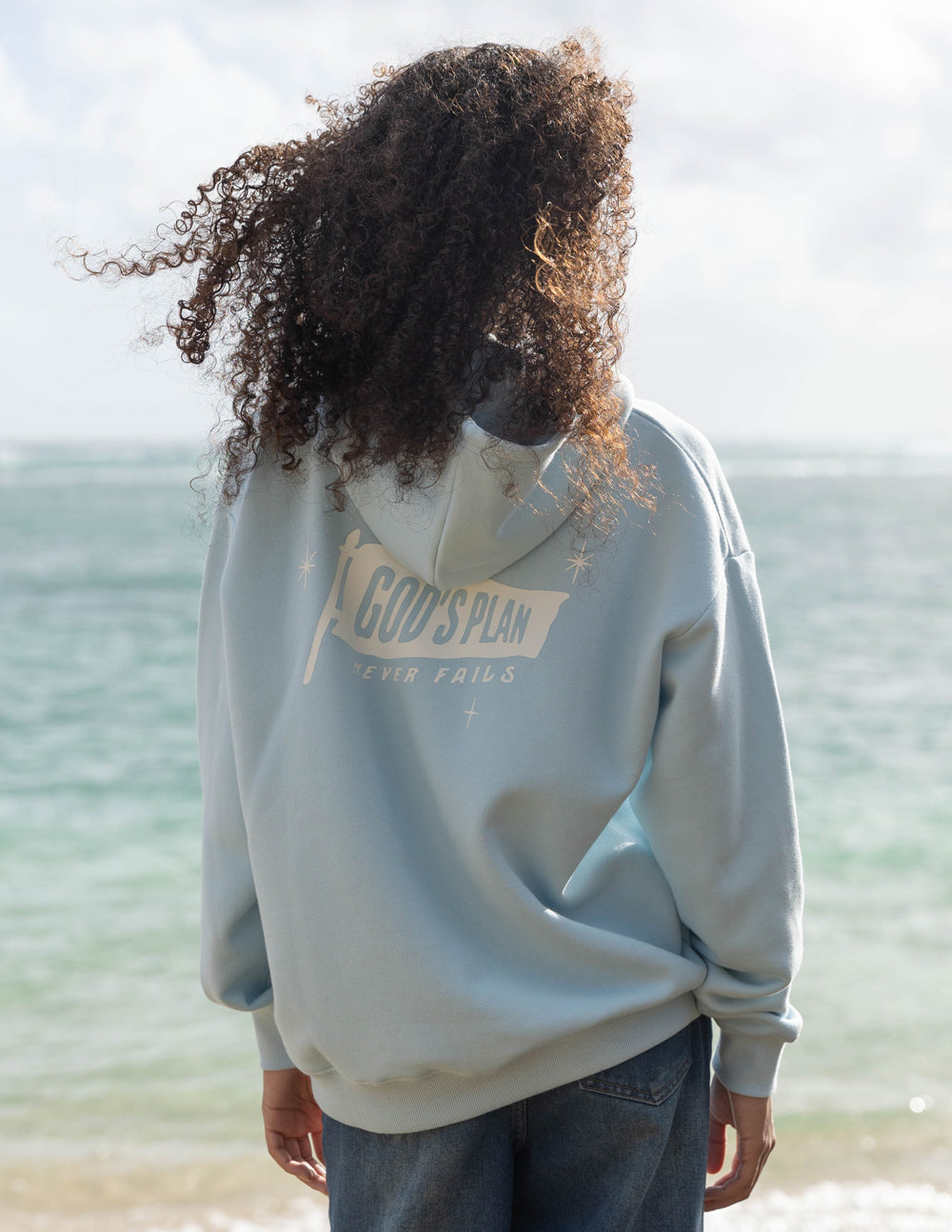 Elevated Faith Christian Hoodie in light blue with 'God's Plan' graphic on the back for casual wear