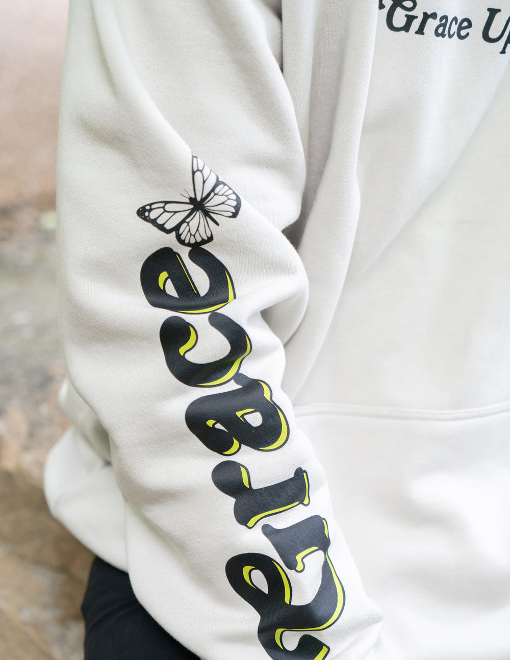 Elevated Faith Christian Hoodie in light gray with butterfly and 'Grace' print on the sleeve