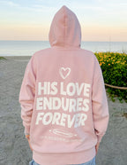 Pink Christian Hoodie from Elevated Faith featuring 'His Love Endures Forever' graphic on the back