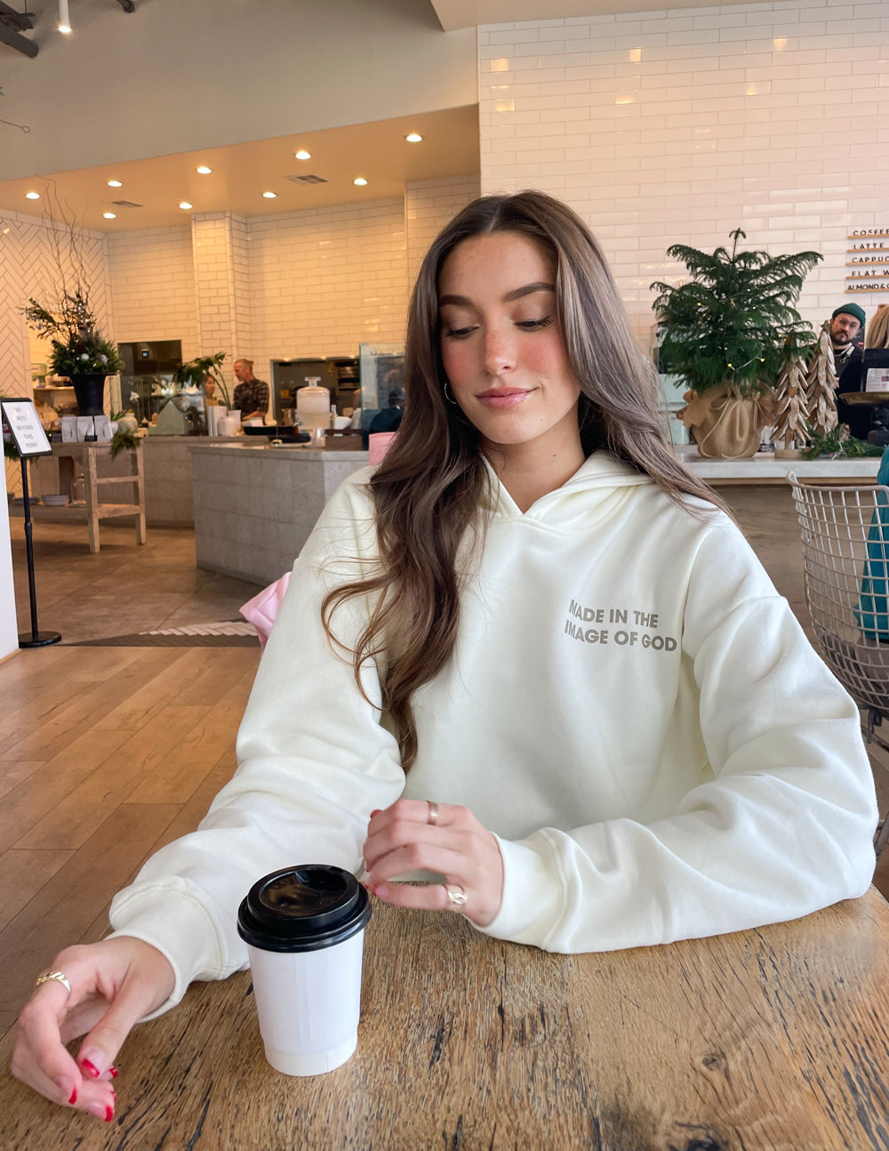 Elevated Faith Christian Hoodie in cream with the phrase 'Made in the Image of God' displayed in front