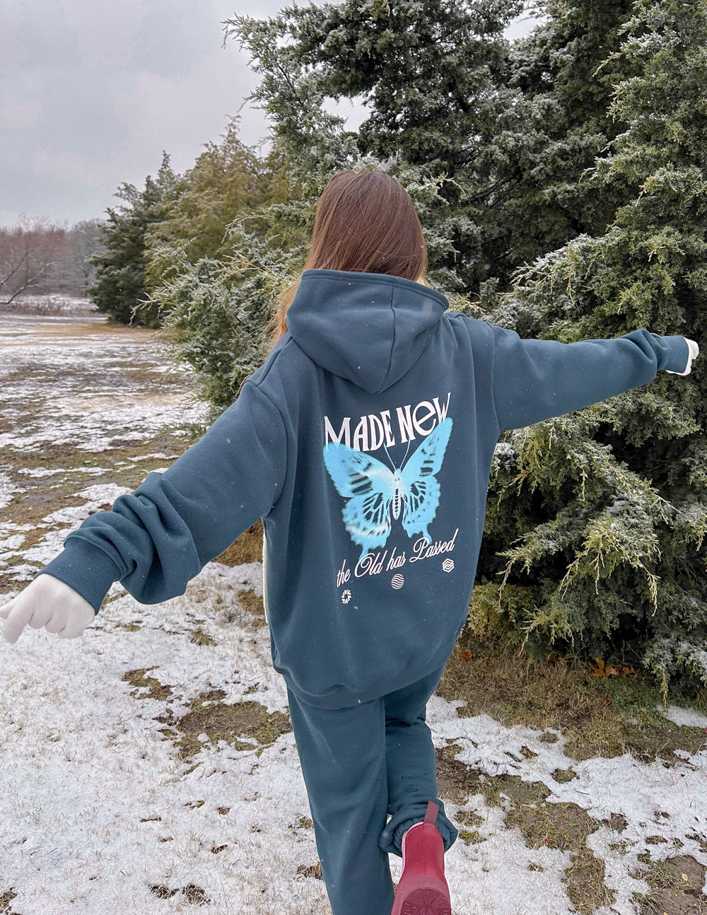Elevated Faith Christian Hoodie featuring a butterfly design and the phrase Made New for a stylish look