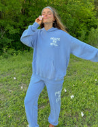 Elevated Faith Christian Hoodie in blue with 'Peace Be Still' design for casual comfort