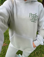 Elevated Faith Christian Hoodie in light gray with 'Perfect Love' print and a front pocket