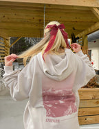 Elevated Faith Christian Hoodie in beige with mountain graphic and strength text on the back