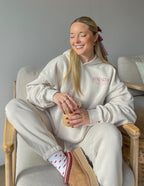 Elevated Faith Christian Hoodie in beige with 'Strength' graphic, perfect for casual comfort