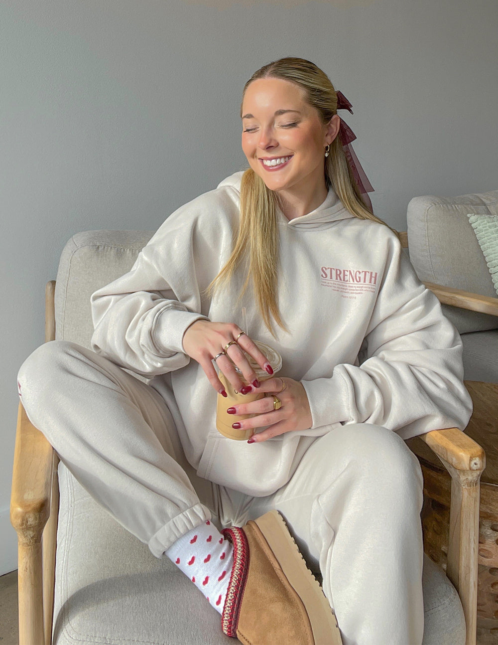 Elevated Faith Christian Hoodie in beige with 'Strength' graphic, perfect for casual comfort