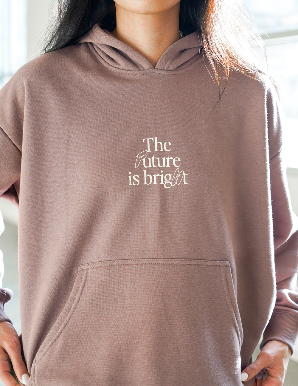 Elevated Faith Christian Hoodie in brown with the text The future is bright on the front