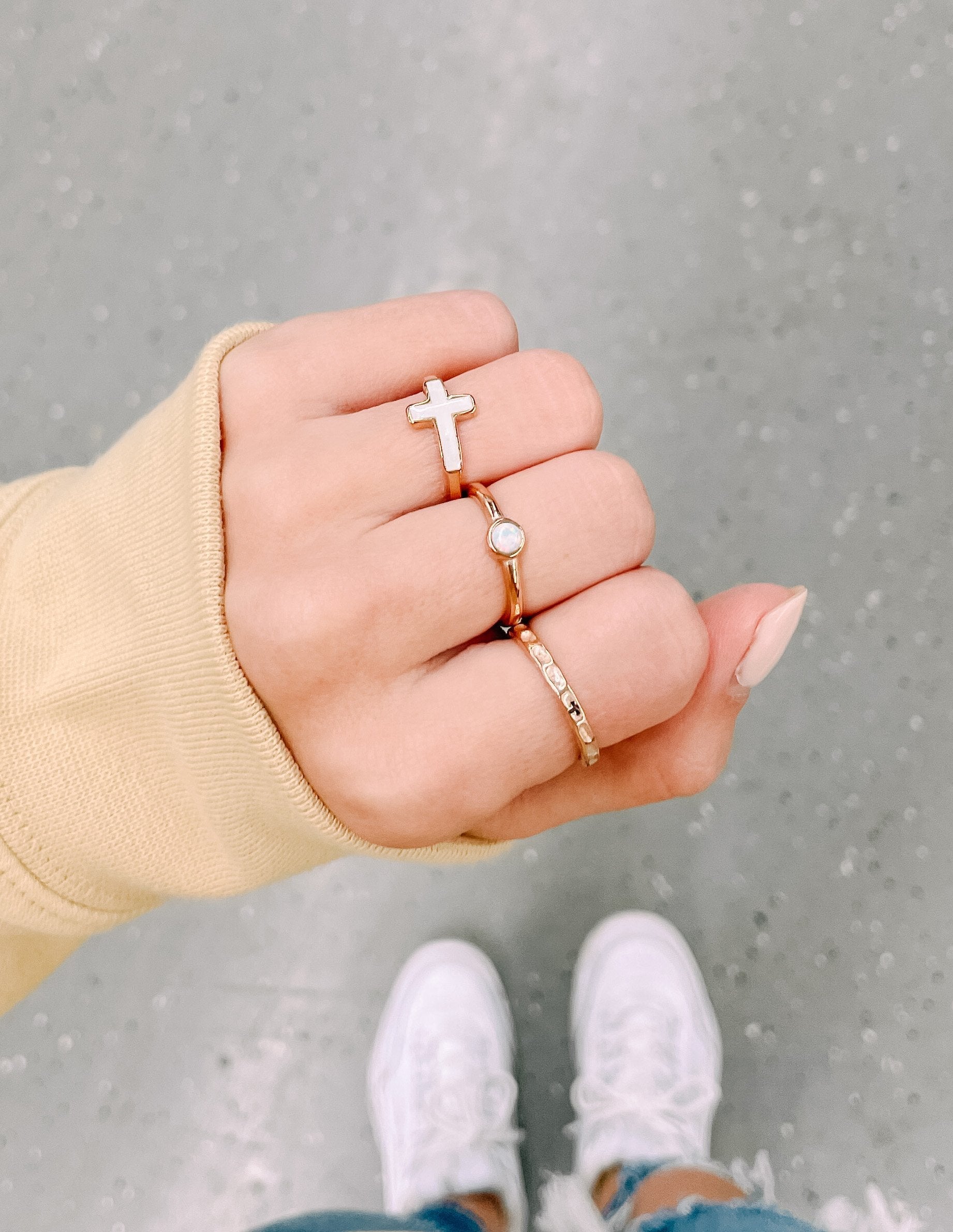 Elevated Faith Christian Jewelry Ring Set featuring a cross and a gemstone design on a hand