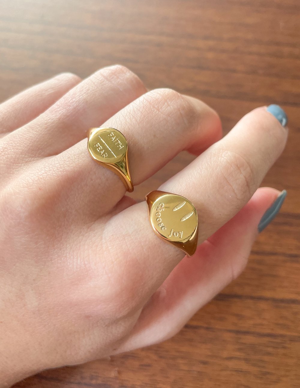 Elevated Faith Gold Christian Jewelry Rings with Inspirational Engravings on a Hand