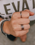 Elevated Faith Christian Jewelry rings stacked on hand showcasing unique designs