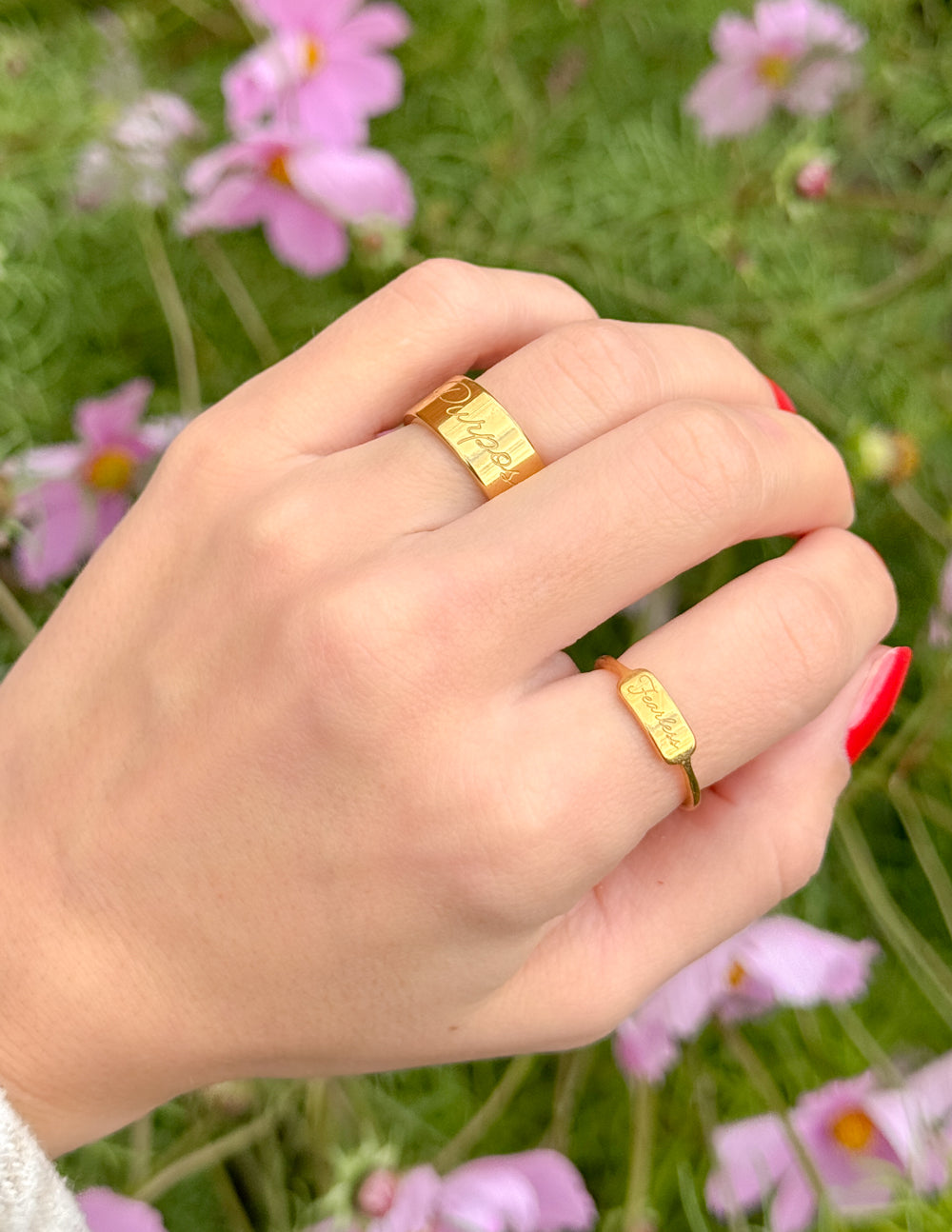 Beautiful Elevated Faith Christian Jewelry rings worn on hand, featuring elegant designs in gold
