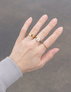 Gold Elevated Faith Christian Jewelry Ring Set Displayed on a Hand with Three Elegant Rings