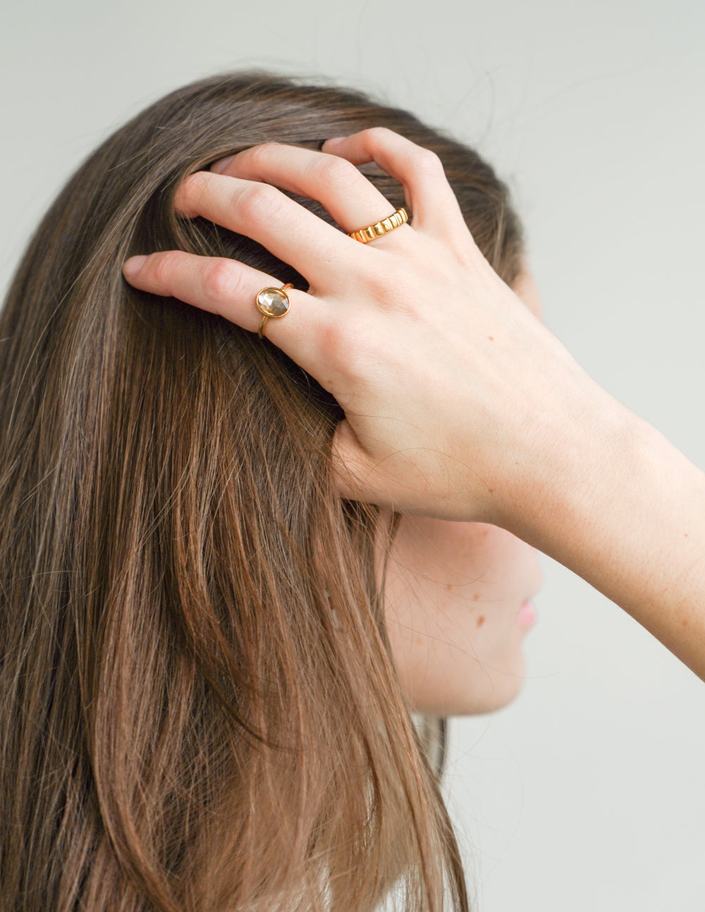 Elevated Faith Christian Jewelry Ring worn on a hand with long hair and a stylish design