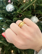 Elevated Faith Christian Jewelry Gold Ring Stack on Hand Celebrating Faith in Festive Setting