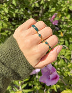 Gold Elevated Faith Ring Set with Green Stones for Christian Jewelry Lovers