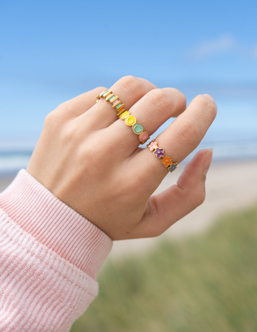 Stackable gold rings featuring colorful stones, perfect for Christian Jewelry enthusiasts