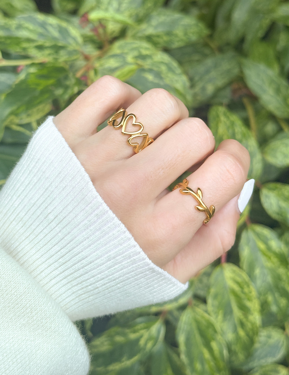 Three gold rings from Elevated Faith showcasing minimalist designs for stylish Christian jewelry