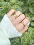 Three gold rings from Elevated Faith showcasing minimalist designs for stylish Christian jewelry