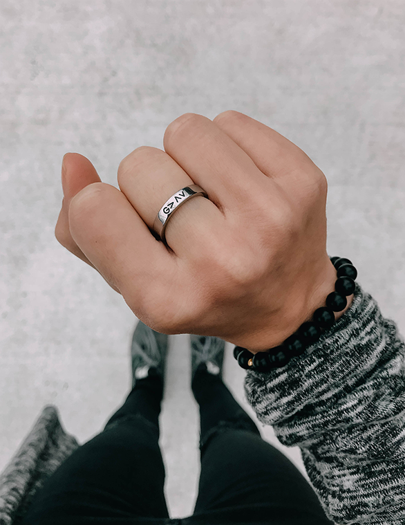 Elevated Faith Christian Jewelry Ring on a hand with a black beaded bracelet for a stylish statement