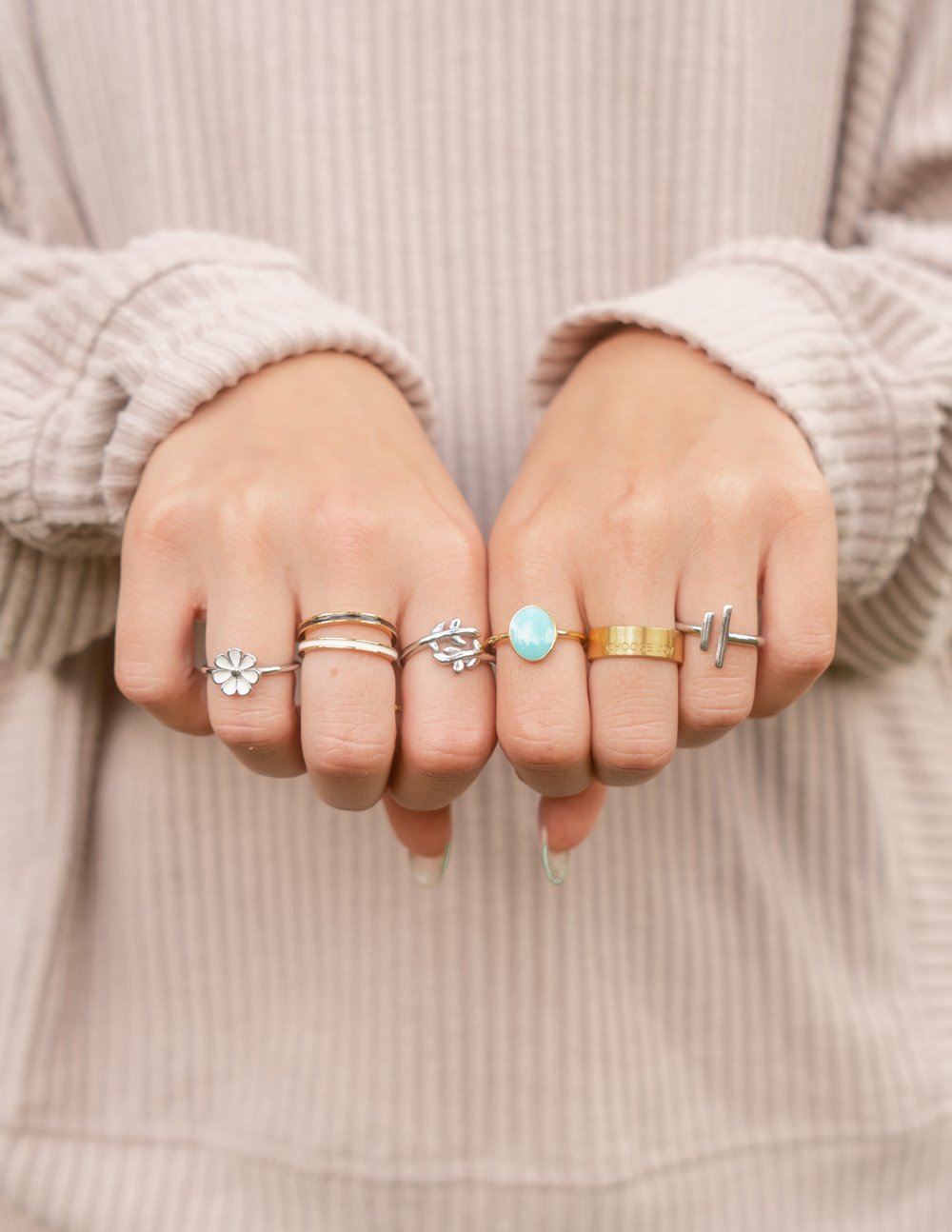 Assorted Elevated Faith rings showcased on hands, featuring styles from Christian Jewelry collection