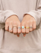 Assorted Elevated Faith rings showcased on hands, featuring styles from Christian Jewelry collection