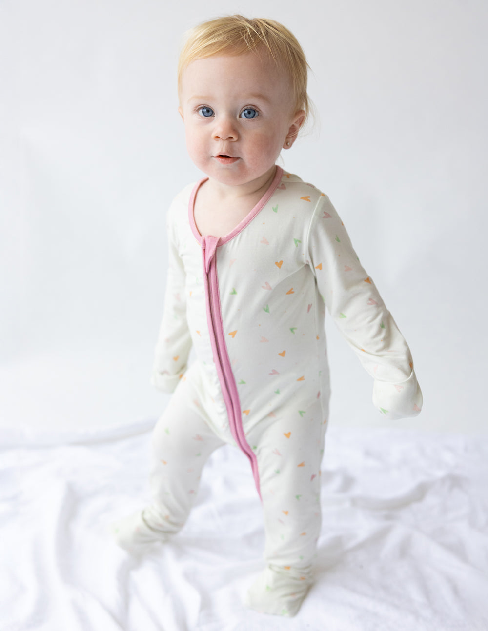 Elevated Faith Christian Kids Apparel White Onesie with Colorful Heart Patterns for Infants