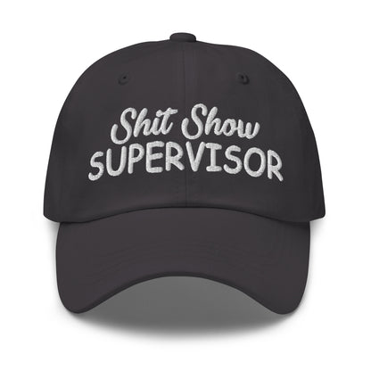 Dark grey dad hat with white embroidered 'Shit Show SUPERvISOR' logo