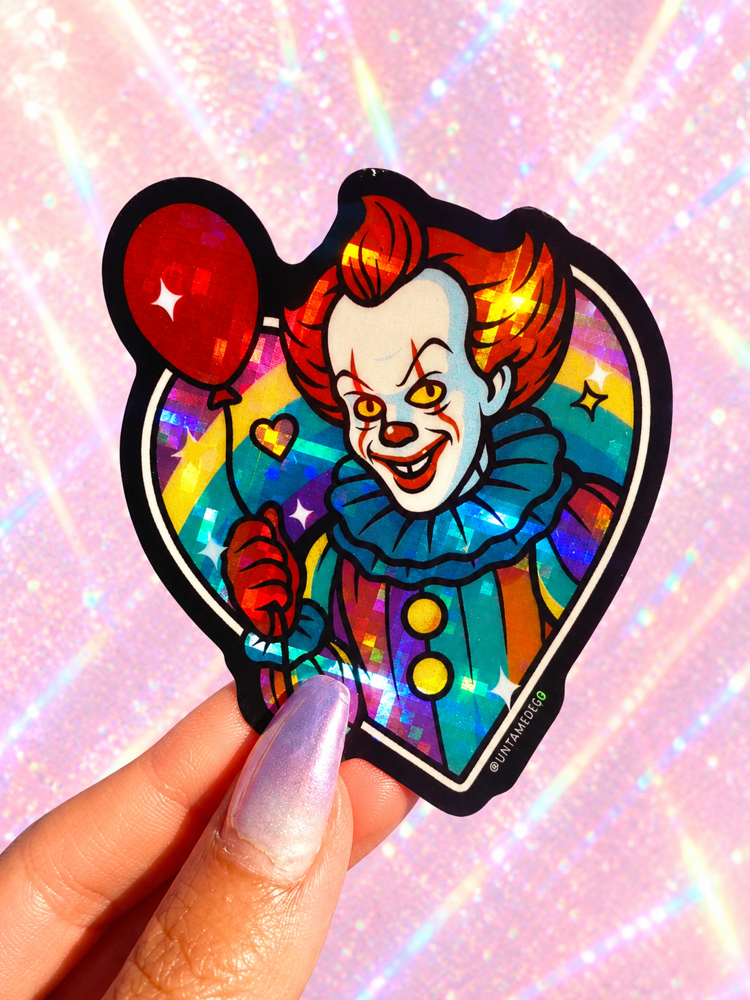 Funny Heart-shaped rainbow holographic clown vinyl sticker with red-orange hair and smiling face