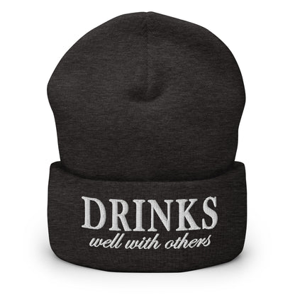 Dark grey knit cuffed beanie with embroidered 'DRINKS' and 'well with others'