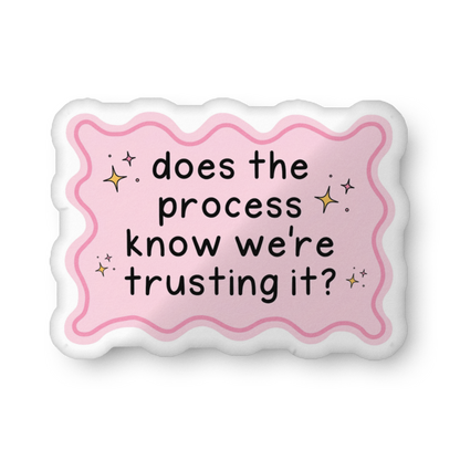 Custom-shaped pillow with pink wavy border and text: does the process know we're trusting?