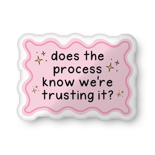 Custom-shaped pillow with pink wavy border and text: does the process know we're trusting?