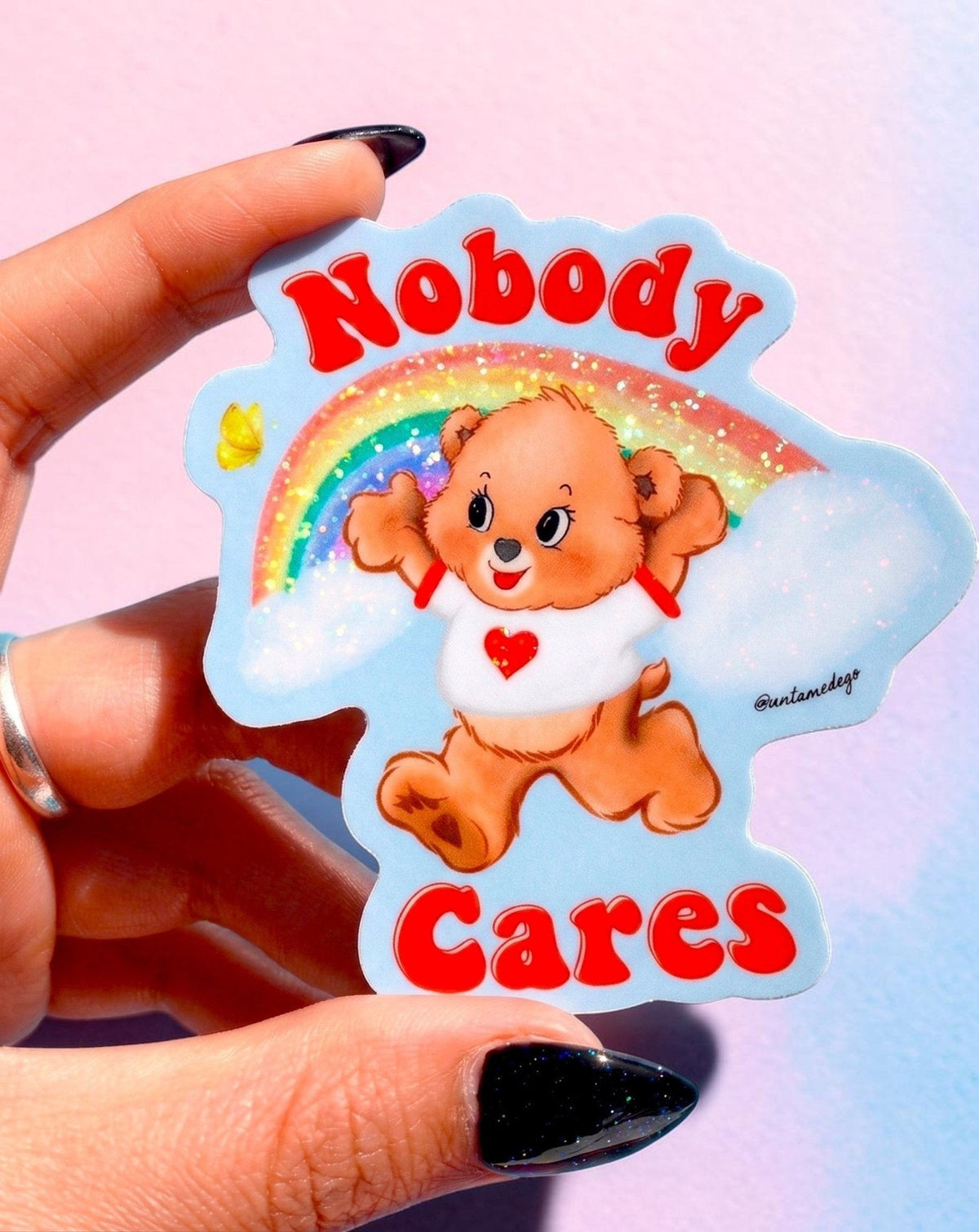 Funny Blue cloud-shaped sticker with cartoon hamster and red 'Nobody Cares' text