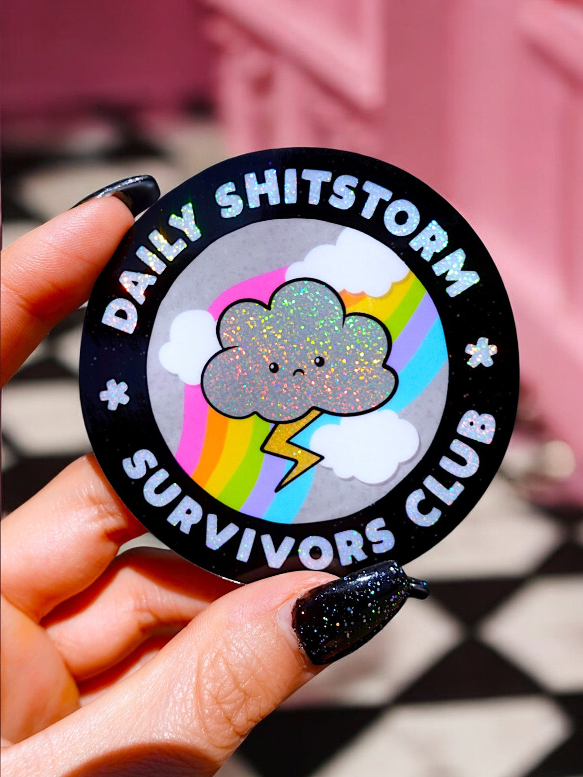 Funny Black round sticker with rainbow cloud and 'Daily SHITSTORM' lettering