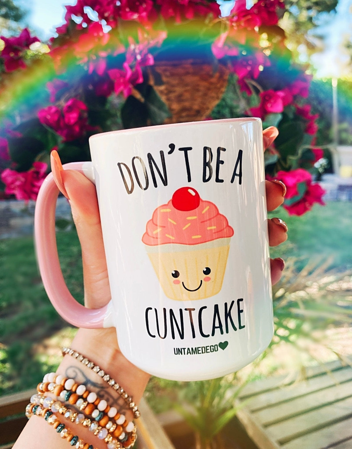 Funny "Don't Be A CuntCake" — White mug with pink handle and cupcake graphic with 'DON'T BE A CUNTCAKE' text