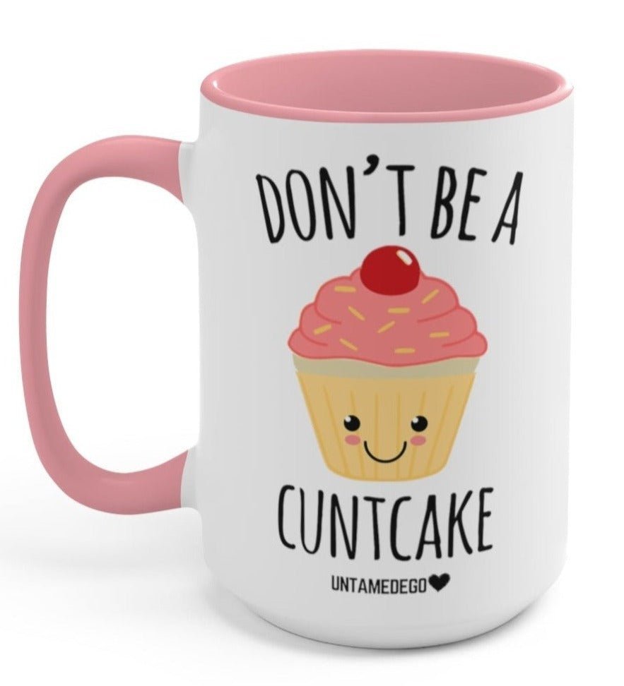 Funny "Don't Be A CuntCake" — White mug with pink handle, cupcake graphic, and 'DON'T BE A CUNTCAKE'