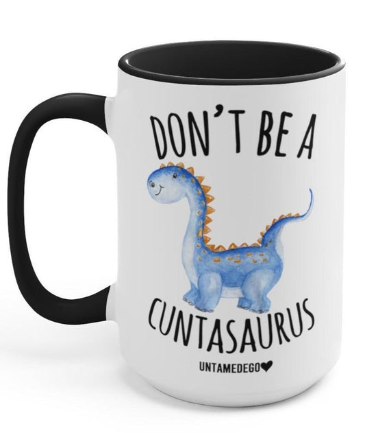 Funny "Don't Be A Cuntasaurus" — 15 oz ceramic mug with black handle and rim, blue dinosaur graphic and humorous text
