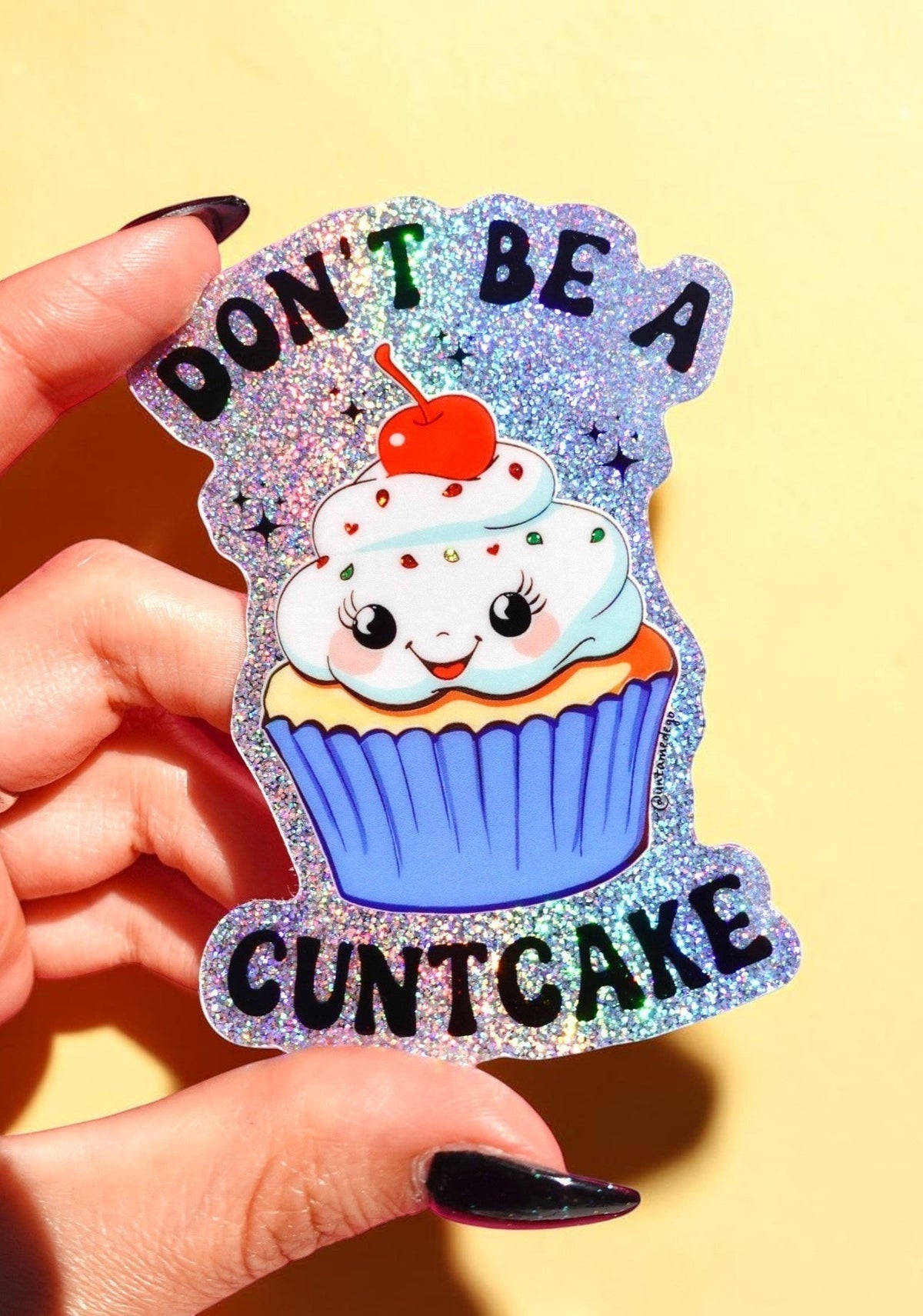 Funny Glitter cupcake cat sticker with orange cherry and blue frosting lettering