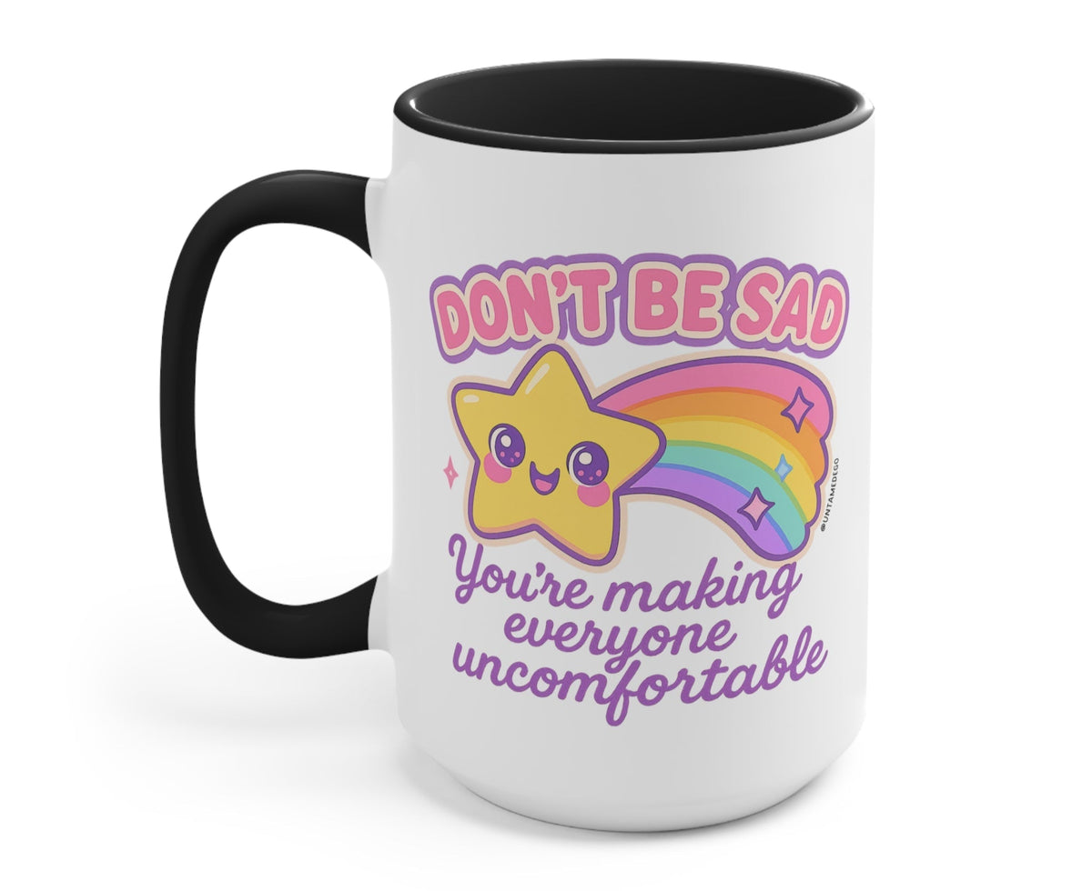 Funny "Don't Be Sad You're Making Everyone Uncomfortable" — White ceramic mug with black handle and interior, colorful cat and rainbow message
