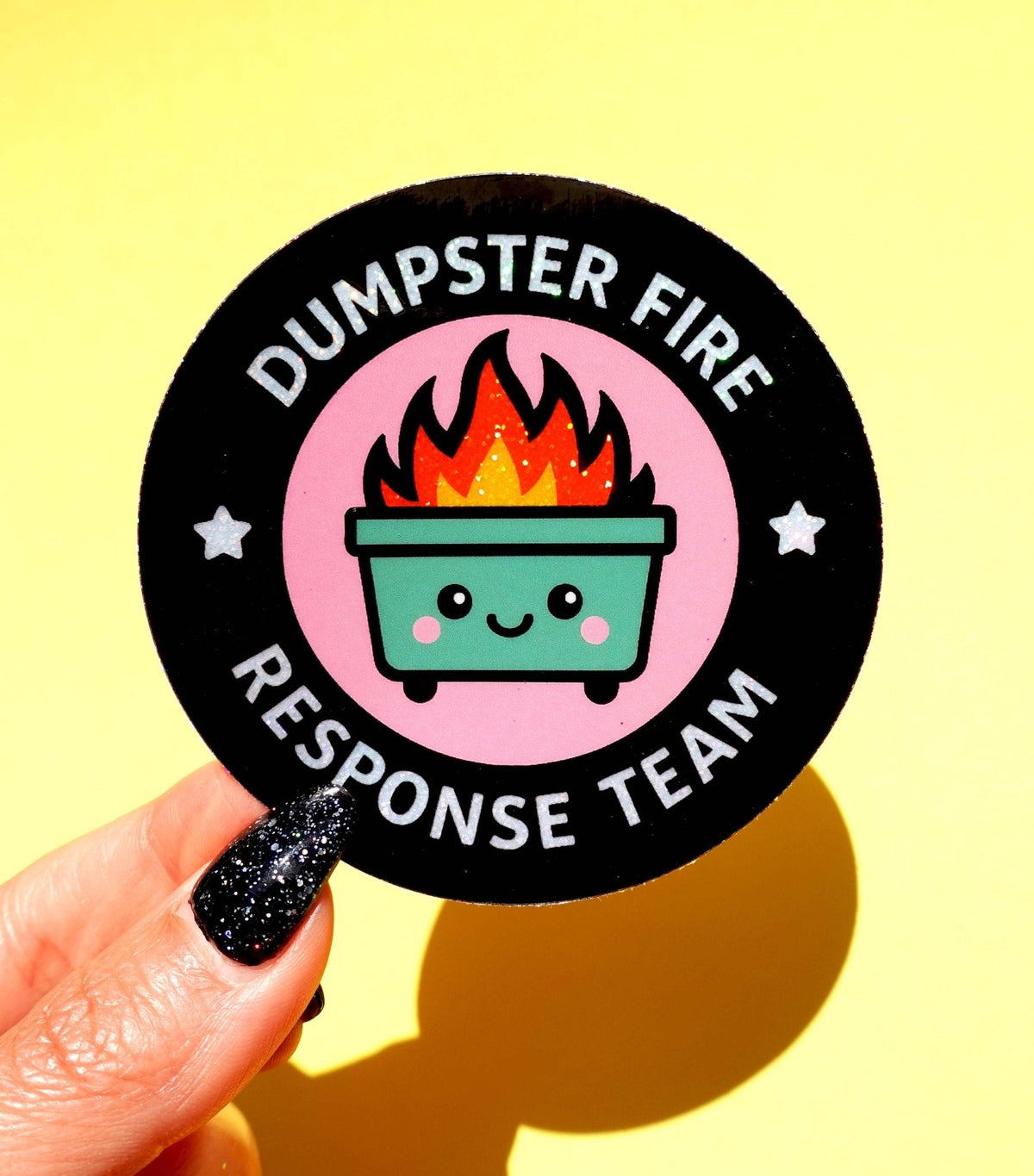 Funny Round black response team sticker with fire pot cartoon and “DUMPSTER FIRE RESPONSE TEAM”