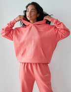 Elevated Faith Christian Hoodie in coral with front pouch pocket and relaxed fit for casual wear