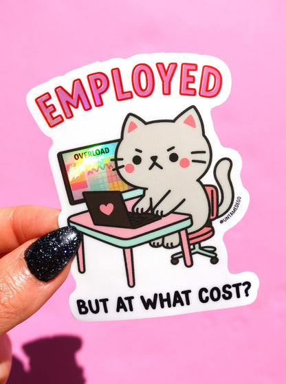Funny Handheld angry kitty at desk sticker, “EMPLOYED” and “BUT AT WHAT COST?”