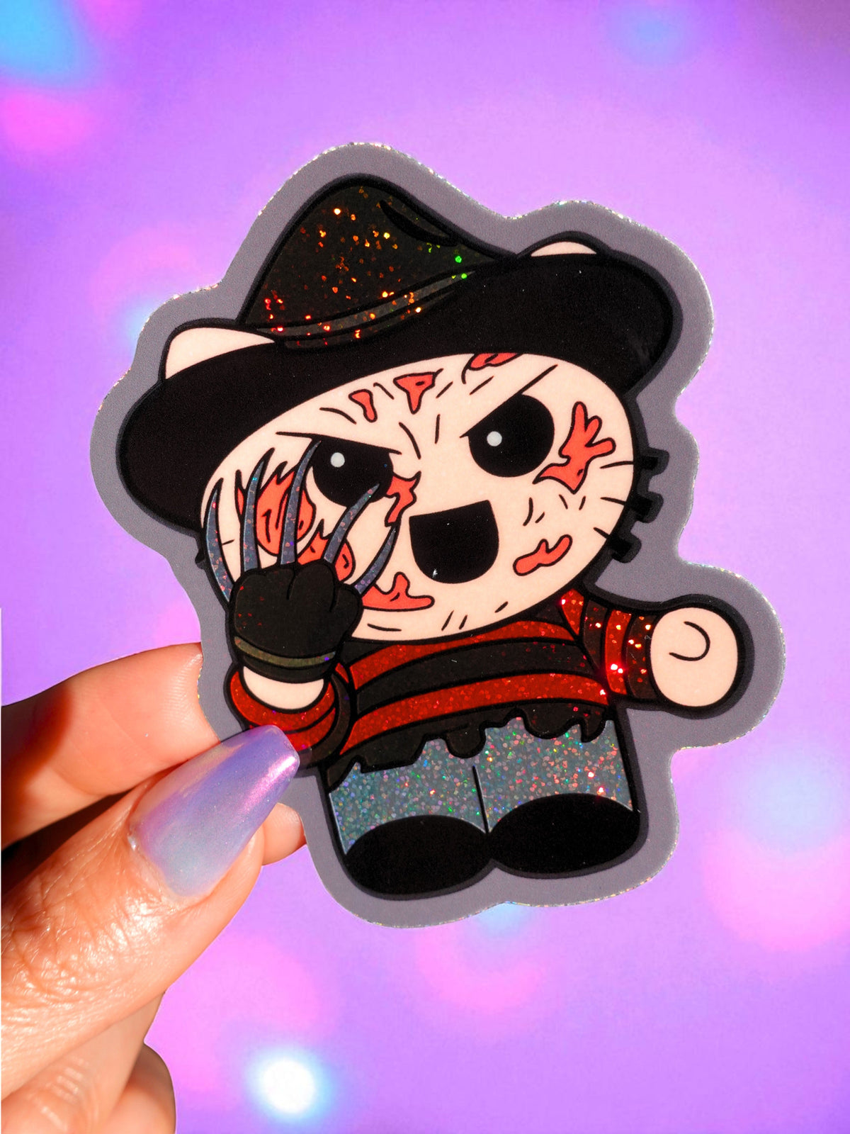 Funny Freddy monster chibi vinyl sticker, black hat, skull makeup, red details, glitter accents