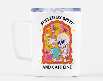 Funny "Fueled By Spite And Caffeine" — White travel mug with lid; colorful skull graphic and text 'Fueled by Spite and Caffeine'.