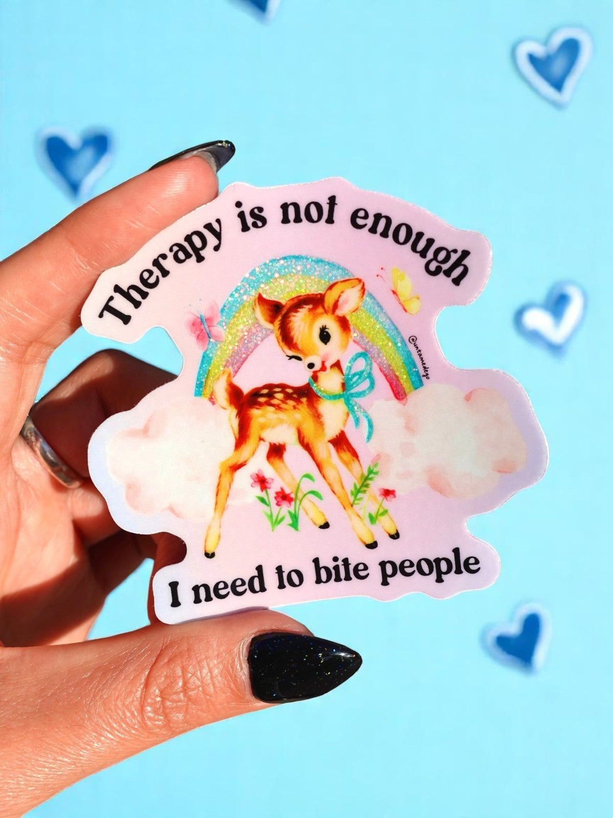Funny Therapy-themed deer sticker with rainbow glitter and text “I need to bite people”