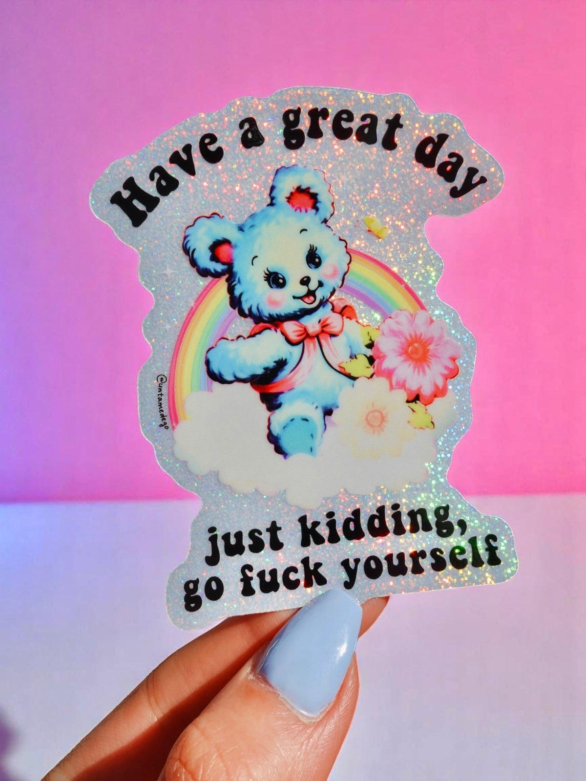 Funny Rainbow glitter sticker featuring blue panda with rainbow, flowers, and text 'just kidding'